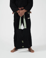 Kingz The ONE V2 LE BJJ Gi Black Green lower body holding included gi bag with green crown and one logo