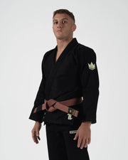 Kingz The ONE V2 LE BJJ Gi Black Green front pose showing green number one logo and contrast stitching