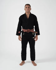 Kingz The ONE V2 LE BJJ Gi Black Green three-quarter angle showing green crown patch and brown belt