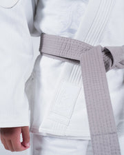 Kingz Born to Rule Youth Jiu Jitsu Gi White - Close-Up Detail View White Textured Fabric Shoulder Reinforcement Patch Minimalist Design BJJ Gi [color:White]