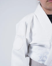 Kingz Born to Rule Youth Jiu Jitsu Gi - White - Close-Up Detail View Embroidered K Logo White Textured Fabric Yellow Belt Contrast Stitching Premium BJJ Training Gi [color:White]
