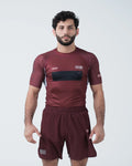 Kingz Trooper Rashguard Maroon - Full Body Front View Male Athlete Short Sleeve KINGZ Logo Black Chest Band Flag Patch Sublimated Graphics