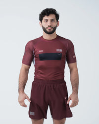 Kingz Trooper Rashguard Maroon - Full Body Front View Male Athlete Short Sleeve KINGZ Logo Black Chest Band Flag Patch Sublimated Graphics