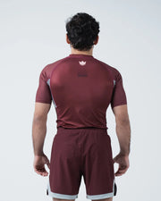 Kingz Trooper Rashguard Maroon - Full Body Straight Back View Male Athlete Short Sleeve Crown Logo Centered Upper Back Dot Pattern Gray Side Panels