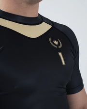 Kingz Player Special Limited Edition Rashguard Black - Close-Up Detail View Gold Chest Crown Badge Number 1 Text Black Mesh Shoulder Panel Short Sleeve Design BJJ Grappling Rash Guard [color:Black]