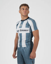 Kingz Vintage Futebol Rashguard Blue White Stripe - Full Body 3/4 Angled Front View Male Athlete Short Sleeve Retro Football Kit KINGZ Crest Badge Cursive Kingz Kimonos Text