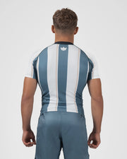 Kingz Vintage Futebol Rashguard Blue White Stripe - Full Body Straight Back View Male Athlete Short Sleeve Crown Logo Upper Back Vertical Stripes Gray Shorts Retro Football