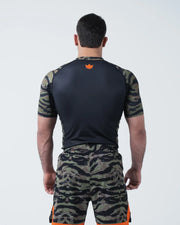 Kingz Always Hunting Rashguard Green Camo - Upper Body Straight Back View Male Athlete Short Sleeve Orange Crown Logo Upper Back Tiger Camo Sleeves Black Back Panel