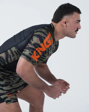 Kingz Always Hunting Rashguard Green Camo - Action Pose Grappling Stance Male Athlete Short Sleeve Tiger Camo Large KINGZ Orange Text Sleeve Camo Shorts BJJ Training