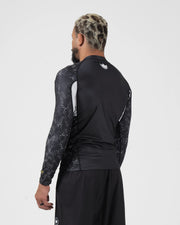 Kingz Ranked Performance V3 L/S Rashguard Black - Full Body 3/4 Back View Right Side Male Athlete Long Sleeve Crown Logo Patterned Dot Sleeves White Arm Panels