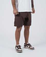 Kingz Casual Gi Shorts Brown Dark Chocolate - Full Body Left Side Profile Male Athlete Dark Brown Ripstop Casual Shorts Relaxed Fit Drawstring Waistband White T-Shirt Brown Nike Dunk Sneakers Men's BJJ Lifestyle [color:Earthy brown]