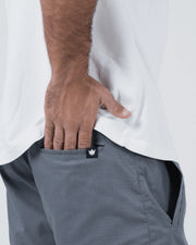 Kingz Casual Gi Shorts - Grey - Side View Hand in Pocket Grey Ripstop Fabric Black Crown Logo Patch Relaxed Fit Grappling Shorts BJJ Training [color:Grey]