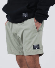 Kingz Casual Gi Shorts Sage Stone Green - Close Up Waistband and Pocket Detail Hand in Side Pocket KINGZ KIMONOS Woven Label Right Thigh and Hoodie Ripstop Fabric Texture Above-Knee Relaxed Fit Men's BJJ Lifestyle [color:Stone Green]