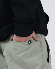 Kingz Casual Gi Shorts Stone Green - Close-Up Detail View Hand Pocket Black Crown Logo Tag Sage Grid Texture Grappling Shorts BJJ Training [color:Stone Green]