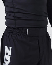 Kingz Kore V2 Shorts Black - Close Up Waistband and Upper Thigh KINGZ KIMONOS White Text Elastic Waistband Large KINGZ White Logo Left Outer Thigh Black Lightweight Grappling Fabric Men's No-Gi BJJ MMA Kore Collection