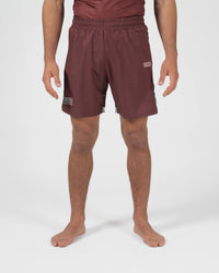 Kingz Trooper Shorts Maroon - Full Body Front View Male Athlete Maroon Burgundy Color KINGZ Badge Right Thigh Flag Badge Left Leg Inner Compression Shorts Gray Trim Competition Cut Men's Grappling Shorts No-Gi BJJ
