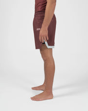 Kingz Trooper Shorts Maroon - Full Body Left-Back Side Profile Male Athlete Maroon Burgundy KINGZ Badge Side Inner Compression Shorts Gray Trim Competition Cut Men's Grappling Shorts No-Gi BJJ