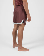 Kingz Trooper Shorts Maroon - Full Body Left Side Profile Male Athlete Maroon Burgundy Flag Badge Left Leg Inner Compression Shorts Gray Visible Side Split Men's Grappling Shorts No-Gi BJJ