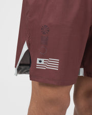 Kingz Trooper Shorts Maroon - Close Up Leg Detail Kingz Crown Flag Badge Left Leg Decorative Dot Leaf Pattern Inner Compression Shorts Gray Visible Side Split Maroon Burgundy Men's Grappling Shorts No-Gi BJJ