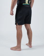 Kingz Player Special Limited Edition Shorts Black Gold - Full Body Left-Back Side Profile Male Athlete All-Black Gold Teal Stripe Waistband Gold Crown Badge Right Leg Competition Cut Men's Grappling Shorts No-Gi BJJ Limited Edition [color:Black]