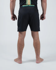 Kingz Player Special Limited Edition Shorts Black Gold - Full Body Right-Back Side Profile Male Athlete All-Black Gold Teal Stripe Waistband Gold Crown Badge Right Thigh Competition Cut Men's Grappling Shorts No-Gi BJJ [color:Black]