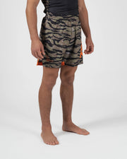 Kingz Always Hunting Shorts Green Camo - Upper Body Front View Male Athlete Tiger Camo Pattern Orange Bold Side Panel Right Side KINGZ Badge Orange Accent Stripe Competition Cut Men's Grappling Shorts No-Gi BJJ