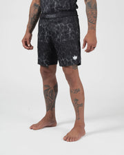 Kingz Acid Wash Shorts Black - Full Body Right Side Profile Tattooed Male Athlete Black White Dot Acid Wash Pattern KINGZ Waistband Text White Crown Logo Right Thigh Competition Cut Men's Grappling Shorts No-Gi BJJ