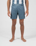Kingz Vintage Futebol Shorts Light Blue - Full Body Front View Male Athlete Steel Blue Color Kingz Kimonos Script Waistband Text Soccer Inspired Competition Cut Shorter Hemline Men's Grappling Shorts No-Gi BJJ
