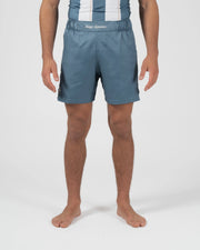 Kingz Vintage Futebol Shorts Light Blue - Full Body Front View Male Athlete Steel Blue Color Kingz Kimonos Script Waistband Text Soccer Inspired Competition Cut Shorter Hemline Men's Grappling Shorts No-Gi BJJ