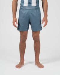 Kingz Vintage Futebol Shorts Light Blue - Full Body Front View Male Athlete Steel Blue Color Kingz Kimonos Script Waistband Text Soccer Inspired Competition Cut Shorter Hemline Men's Grappling Shorts No-Gi BJJ