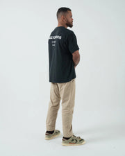 Kingz HQ V2 Tee - Full Body Back Side Lifestyle - Kingz Kimonos HQ San Diego Back Print Black Oversized BJJ Tee Worn