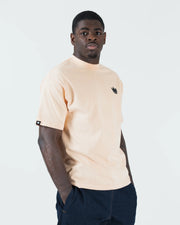 Kingz Jiu Jitsu Motion Tee - Lifestyle Front Shot - Crown Logo Detail - Peach BJJ Pigment Dye T-Shirt