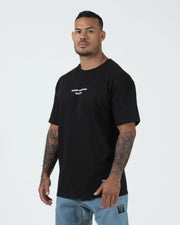 Kingz Solo Tee - Front Three Quarter Angle - Kingz Kimonos Est 2011 Chest Text Worn - Black BJJ T-Shirt