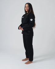 Kingz Kore V2 Women's BJJ Gi Black - Full Body Side Profile View Female Athlete Black Belt Crown Logo Chest Women's Fitted Silhouette