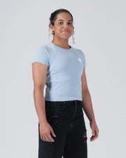 Kingz Kore Women's Baby Tee - Lifestyle Shot - Waist Up Smiling Pose - Baby Blue Women's BJJ Tee [color:Baby Blue]