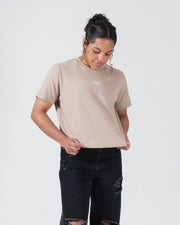 Kingz Women's Heavyweight Tee - Lifestyle Shot - Model Adjusting Boxy Hem - French Oak Women's BJJ Tee