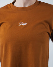 Kingz Women's Heavyweight Tee - Detail Shot - Kingz Script Embroidery Close-up - Vintage Orange Women's BJJ Tee
