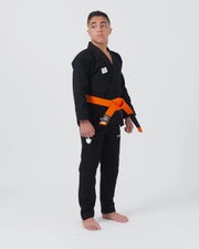 Kingz Kore V2 Youth BJJ Gi Black - Full Body Front View Teen Athlete Orange Belt KINGZ Patch Crown Logo Youth Gi