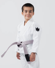 Kingz Kore V2 Youth BJJ Gi White - Upper Body 3/4 Angled Front View Young Athlete Gray Belt Crown Logo Sleeve Youth Size