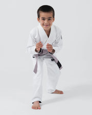 Kingz Kore V2 Youth BJJ Gi White - Dynamic Fighting Stance Young Child Athlete Gray Belt Action Pose Youth Kids Gi