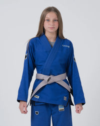 Kingz Nano 3.0 Youth BJJ Gi Blue - Upper Body Front View Girl Athlete Gray Belt NANO Text Crown Logo 380gsm Youth Kids Size