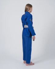 Kingz Nano 3.0 Youth BJJ Gi Blue - Full Body 3/4 Back View Girl Athlete Gray Belt Crown Logo Youth Kids Nano Lightweight