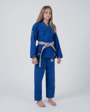 Kingz Nano 3.0 Youth BJJ Gi Blue - Full Body Front View Girl Athlete Gray Belt Crown Logo NANO Text Pants Leg KINGZ Badge Youth