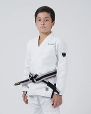 Kingz Nano 3.0 Youth BJJ Gi White - 3/4 Angled Upper Body View Young Athlete Gray Belt Crown Logo NANO Text Youth Kids