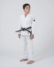 Kingz Nano 3.0 Youth BJJ Gi White - Full Body Angled Front View Young Athlete Gray Belt Crown Logo NANO Text Pants Leg Youth