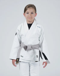 Kingz Nano 3.0 Youth BJJ Gi White - Upper Body Front View Girl Athlete Gray Belt NANO Text Crown Logo 380gsm Youth Kids Size