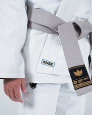 Kingz Nano 3.0 Youth BJJ Gi White - Upper Body Front View Girl Athlete Gray Belt NANO Text Crown Logo 380gsm Youth Kids Size