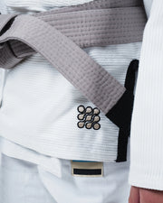 Kingz Nano 3.0 Youth BJJ Gi White - Upper Body Front View Girl Athlete Gray Belt NANO Text Crown Logo 380gsm Youth Kids Size