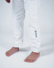 Kingz Nano 3.0 Youth BJJ Gi White - Upper Body Front View Girl Athlete Gray Belt NANO Text Crown Logo 380gsm Youth Kids Size