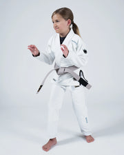 Kingz Nano 3.0 Youth BJJ Gi White - Upper Body Front View Girl Athlete Gray Belt NANO Text Crown Logo 380gsm Youth Kids Size
